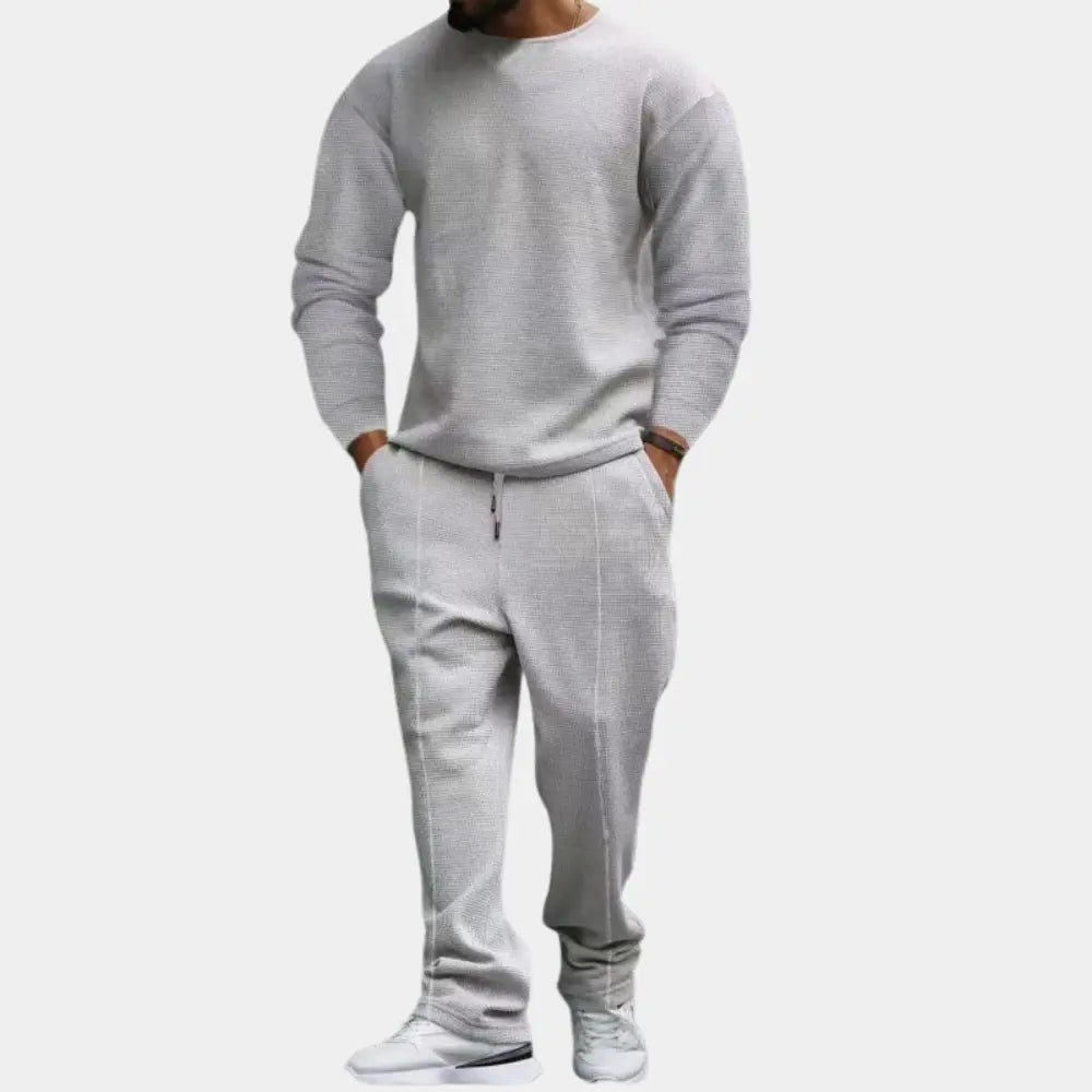 https://cdn.shopify.com/s/files/1/0879/0949/9227/files/Grijs_Ellroy_Luxe_Heren_Tweedelige_Set_Tijdloos_comfort_voor_de_moderne_man_T-E.png