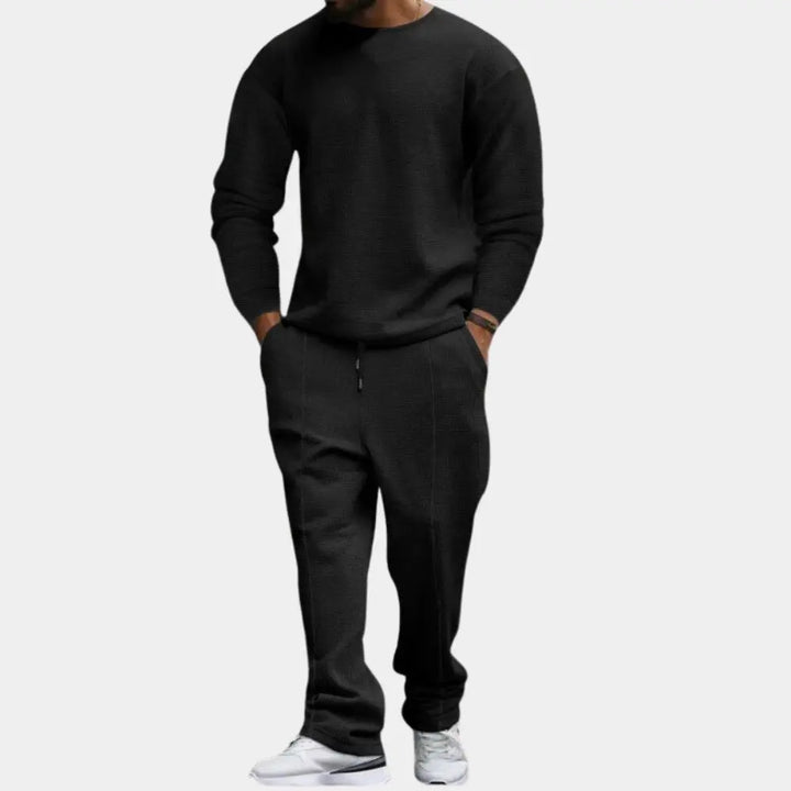 https://cdn.shopify.com/s/files/1/0879/0949/9227/files/Zwart_Ellroy_Luxe_Heren_Tweedelige_Set_Tijdloos_comfort_voor_de_moderne_man_T-E.png